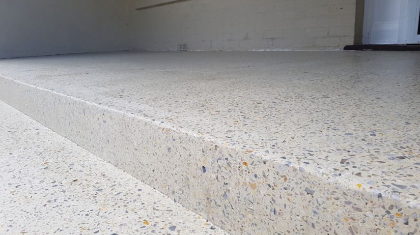 A light sandy aggregate concrete patio