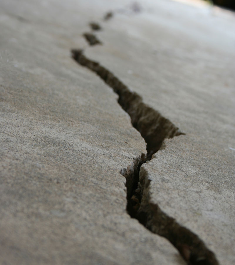 An image showing really badly cracked concrete