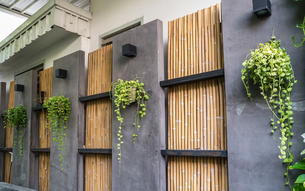 A bamboo and concrete garden wall