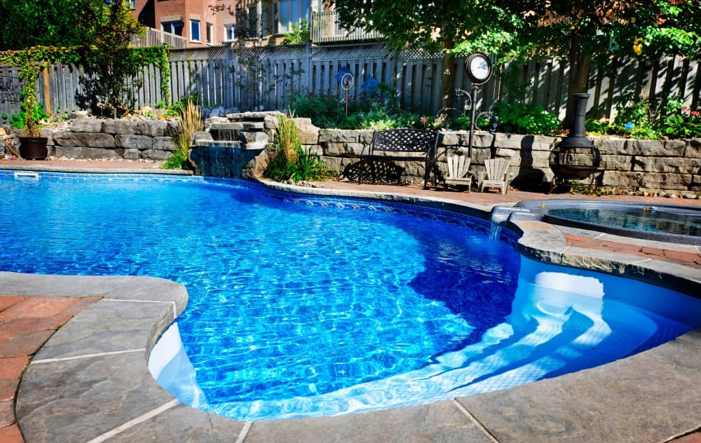 Creating a home pool with a rock waterfall can be a beautiful and relaxing addition to your outdoor space.